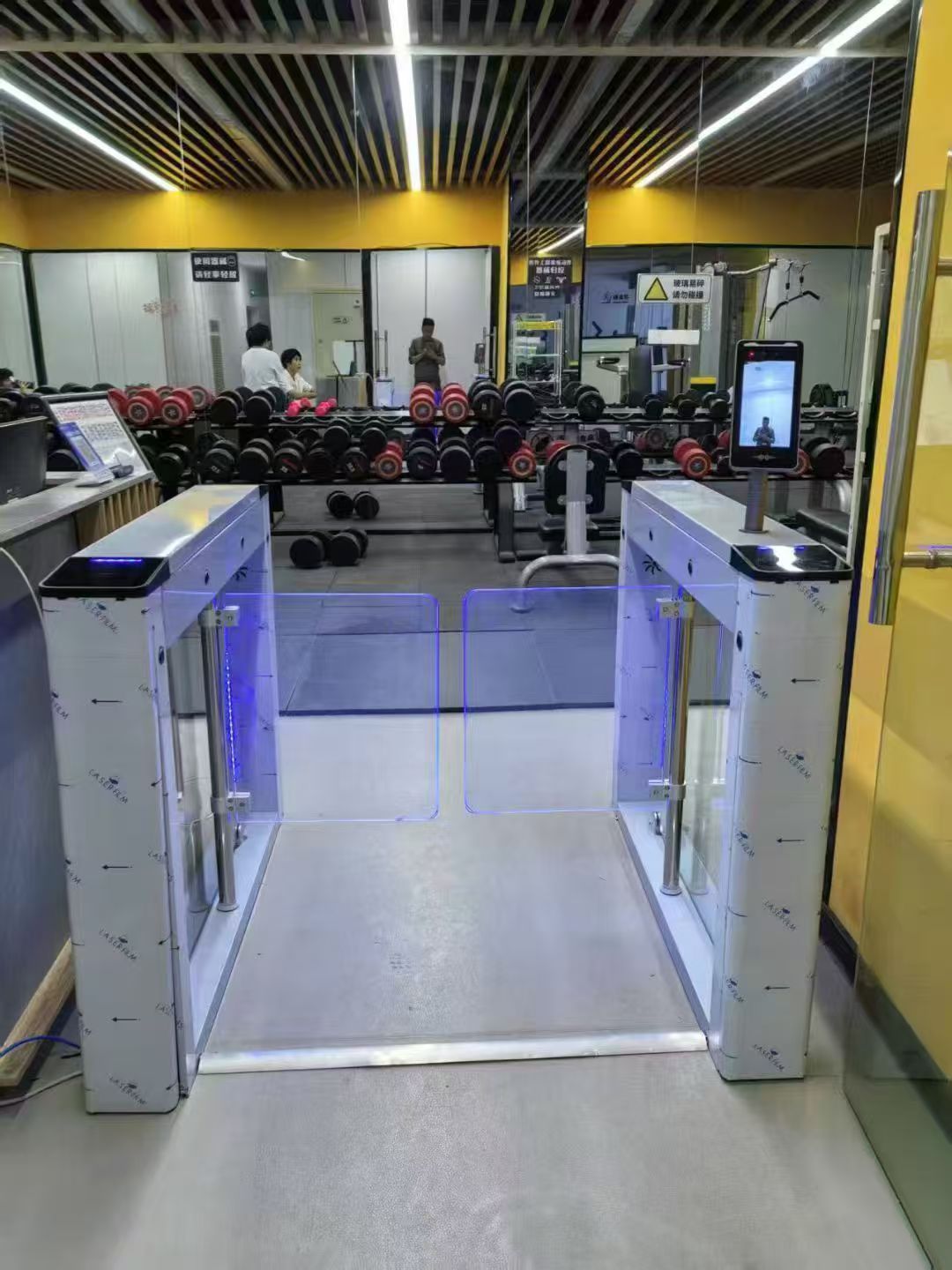 Baroxon automatic swing barrier gate installation in corporate commercial office lobby